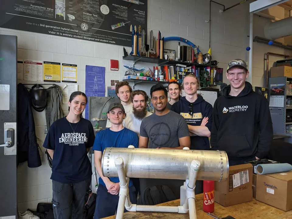 MACH and Waterloo Rocketry members with the ethanol tank after the May 2024 proof test