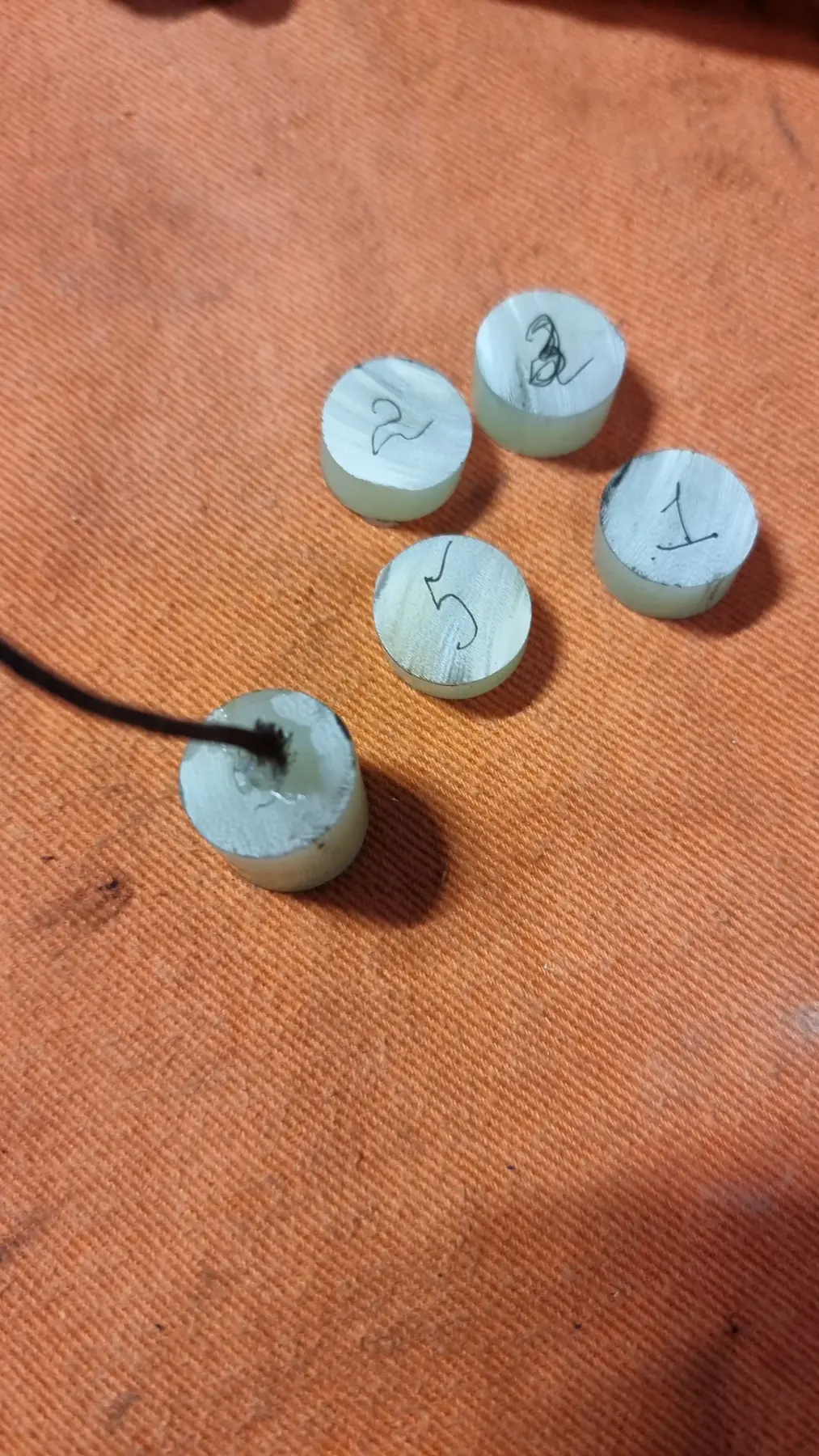 Numbered Garolite samples after burn testing