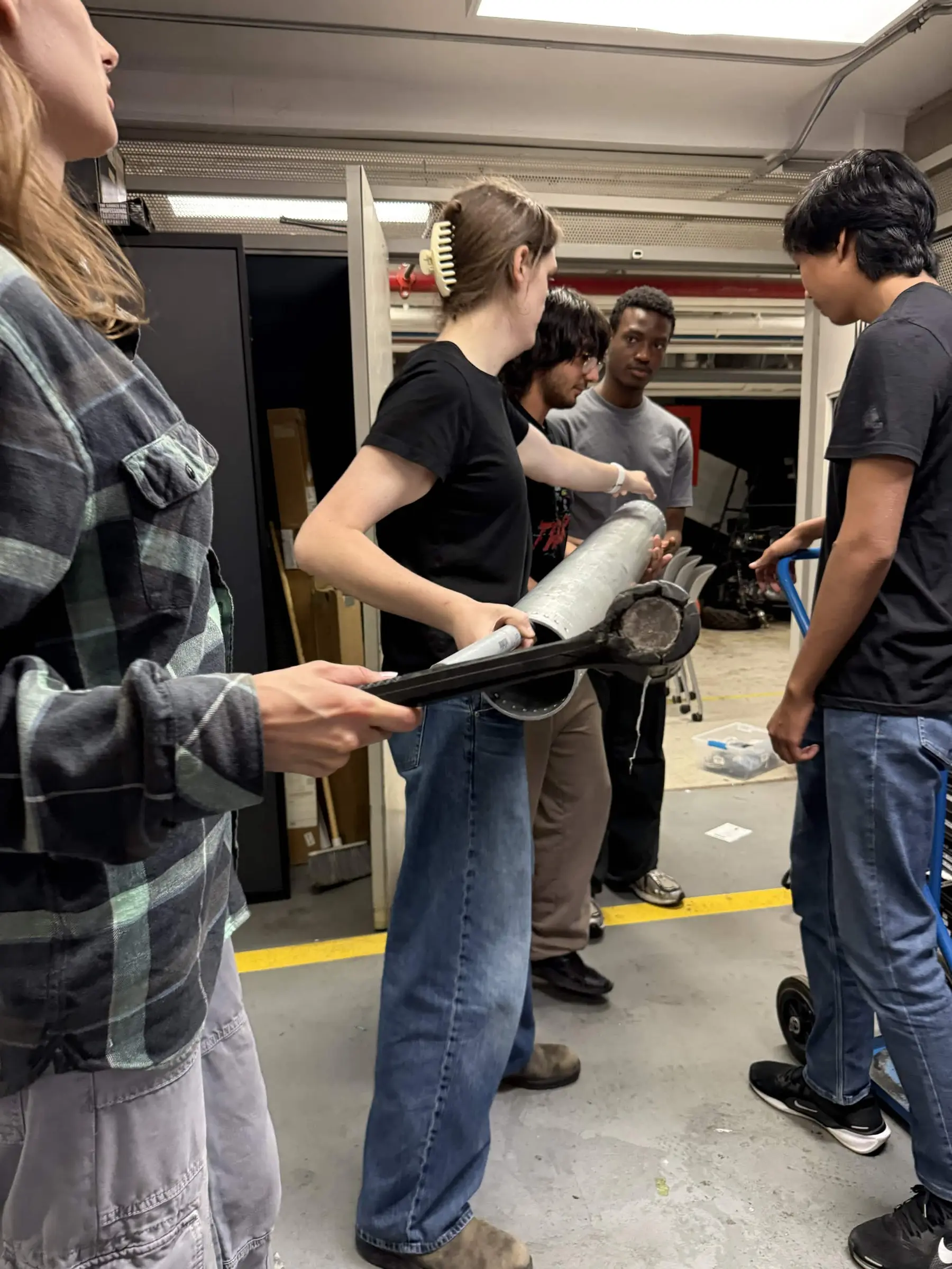 MACH members disassembling the Seraphina tank after its June 26, 2026 proof test